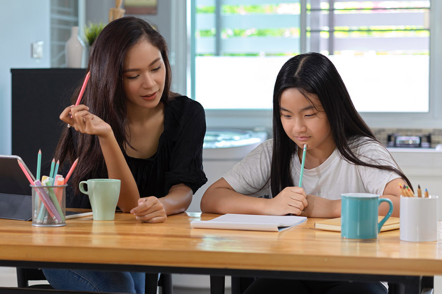 student and tutor together at a desk in Richmond